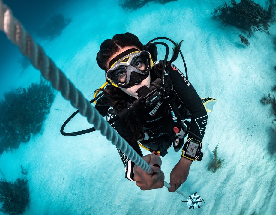 Ascending scuba diver